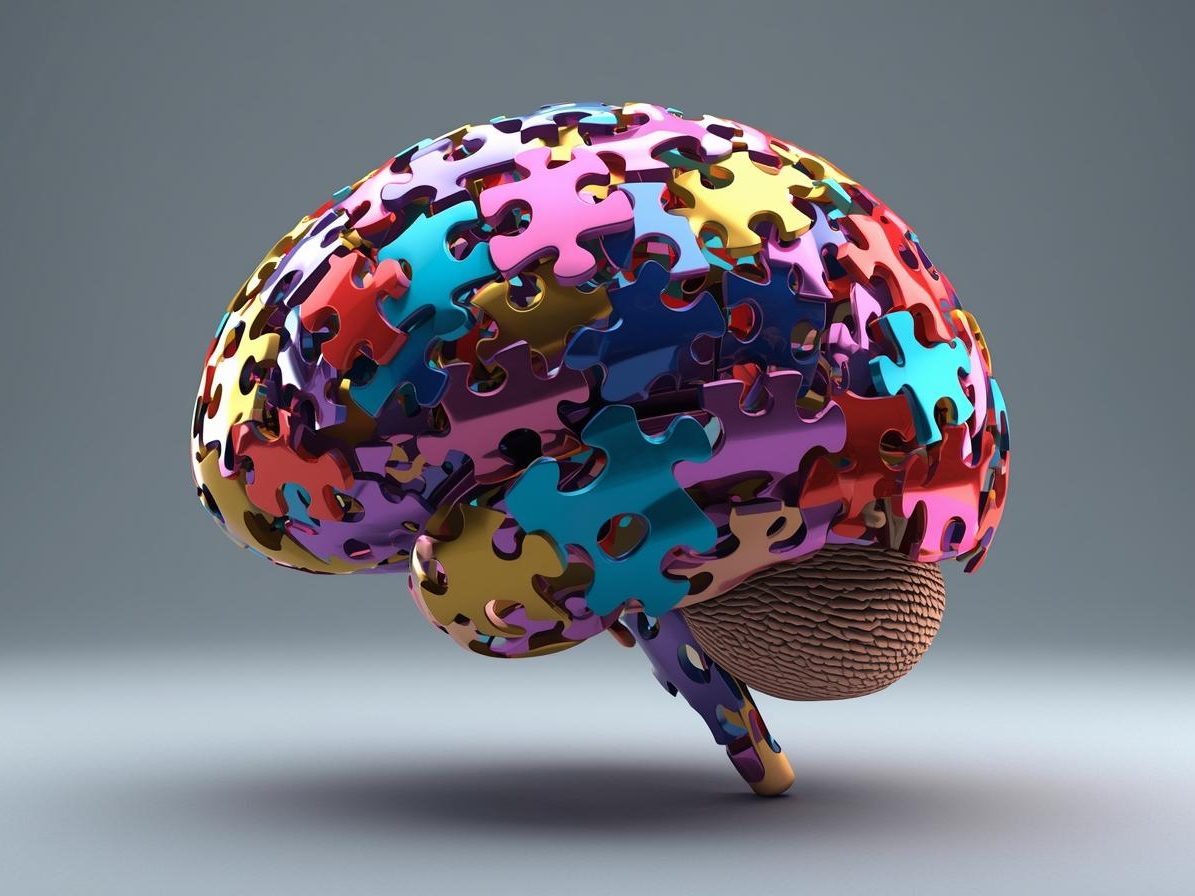 Ein Gehirn, das aus bunten Puzzlestücken zusammengesetzt ist. Denkspiele, die dich klüger machen 